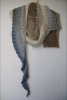 Lace beaded shawl knitted of long gradient dyed fingering weight cotton. The colour is "Ebb Tide".