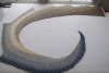 Lace beaded shawl knitted of long gradient dyed fingering weight cotton. The colour is "Ebb Tide".
